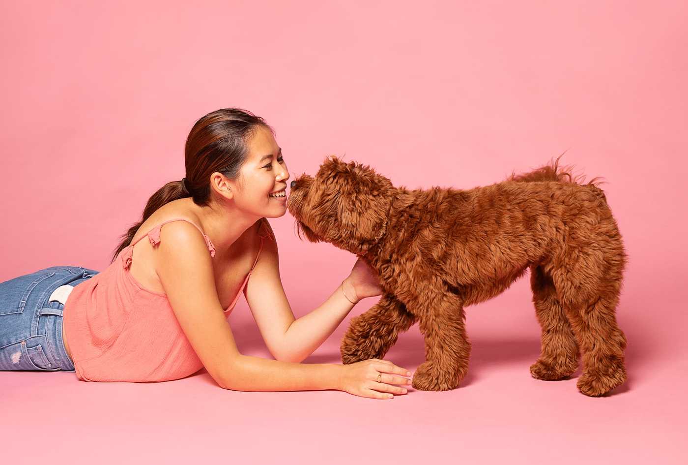 Woman and her dog looking at each other